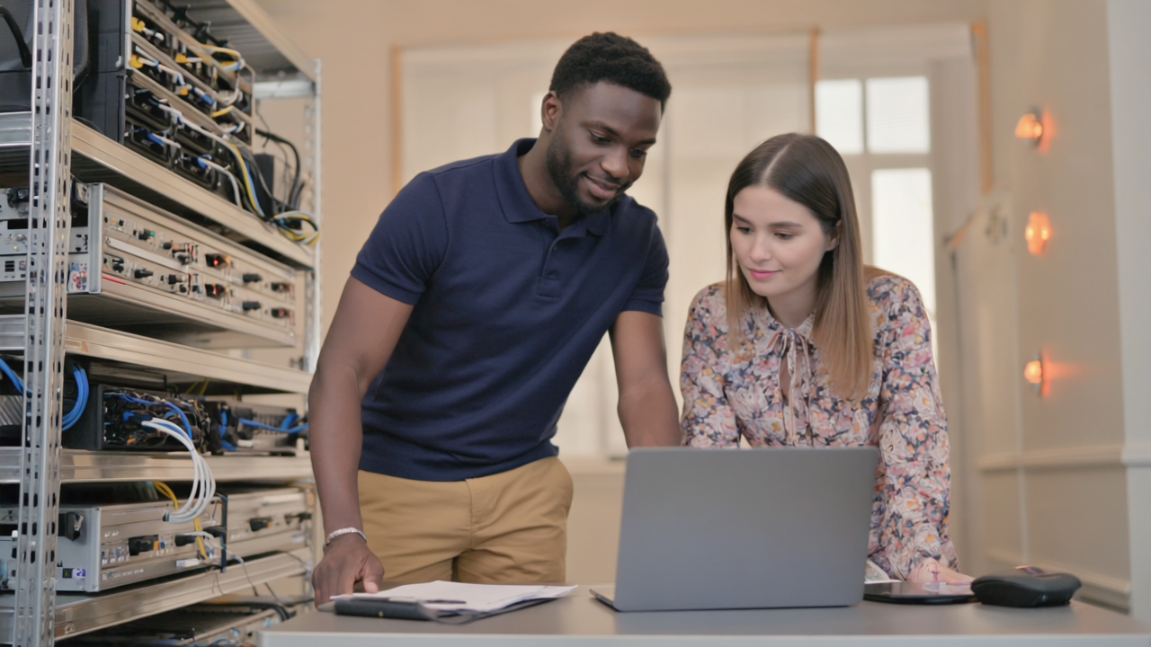 Enthusiastic students and teachers collaborating with laptops and smartboards—showing tech in action at school