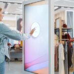 A Young Girl is Using Digital Signage