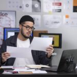 A Man is Checking the Common Logo Design Mistakes