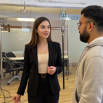 Jessica and Omar engaged in a thoughtful and confident discussion about digital strategy fundamentals in a professional UK office environment.