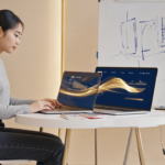 A modern web design studio in the UK with a female designer working on an AI-enhanced website on her laptop, surrounded by sketches and data visualizations illustrating AI's impact on web design.