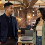 Zak and Sara engaged in a focused discussion about AI transforming SEO strategies in a UK office environment.