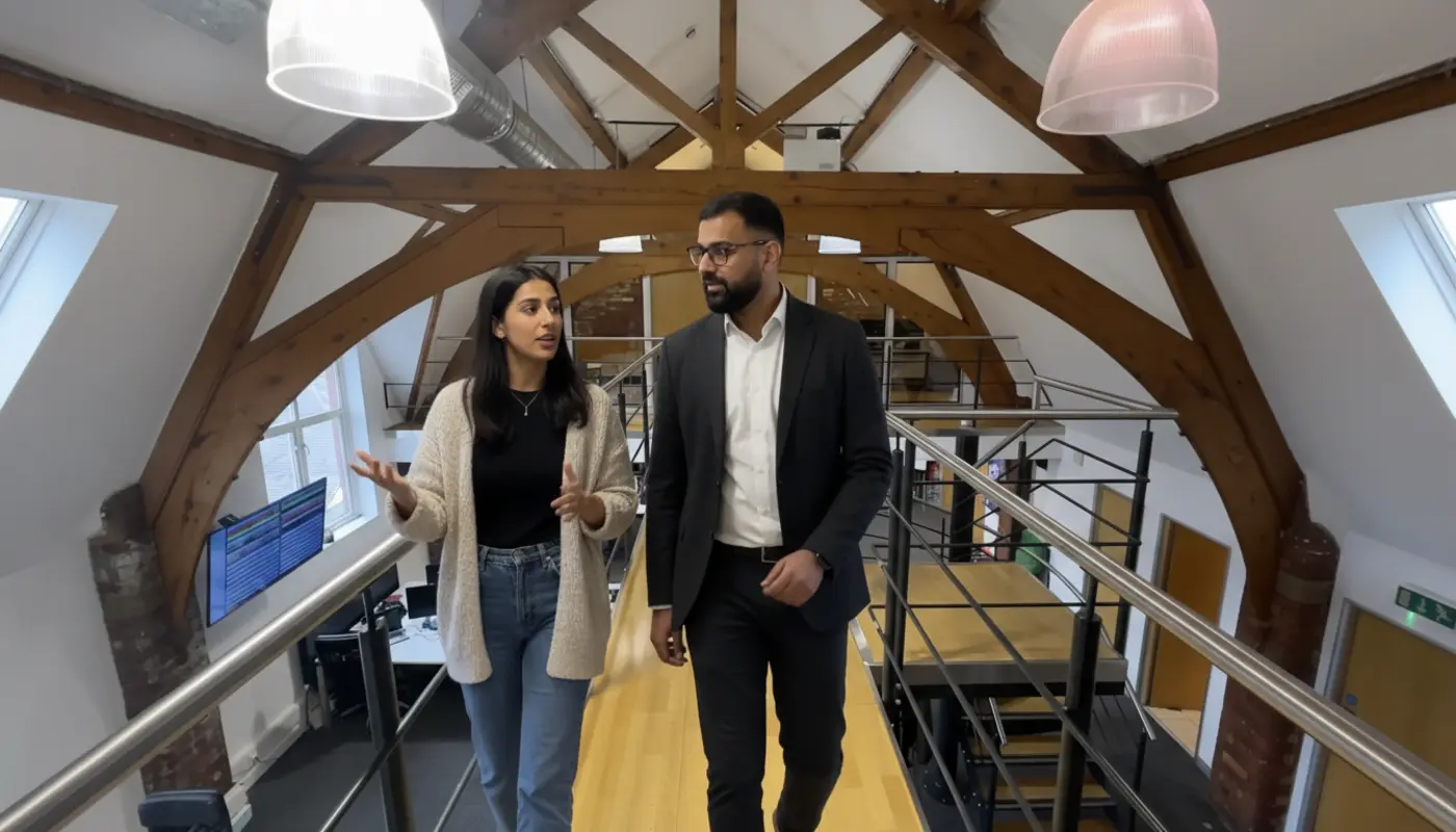 UK small business owner creating TikTok content on smartphone with product display and analytics on screen